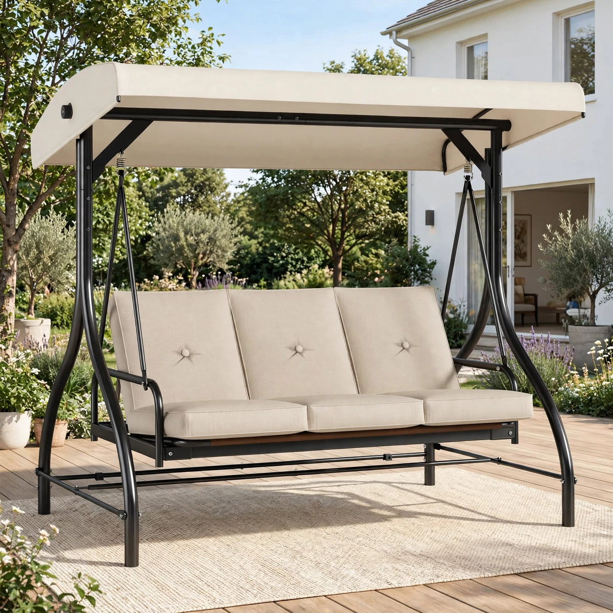 Premium 3-seater patio swing in cream with adjustable canopy in lush garden setting with house in background