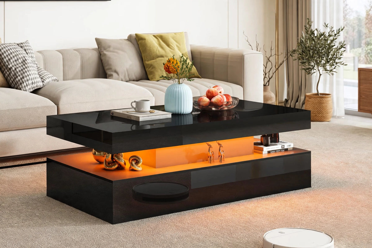 Modern black high-gloss coffee table with LED lighting in bright sunlit living room with beige sofa and olive tree